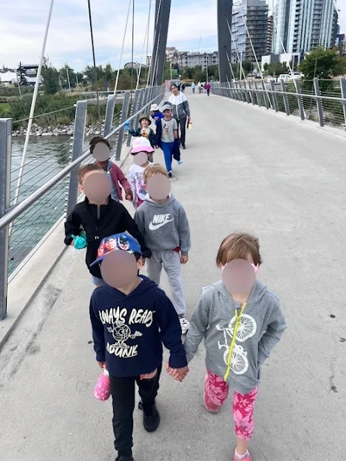 Village Scholars Preschool photo: walking together over the bridge