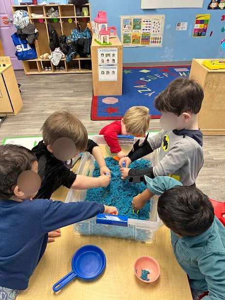 Village Scholars Preschool photo: building together with loose parts and blocks