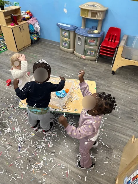 Village Scholars Preschool photo: paper shred play with big movement